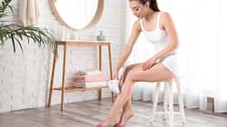 Young,Woman,Doing,Leg,Epilation,Procedure,Indoors.,Space,For,Text