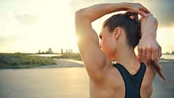 Athletic,Woman,Warming,Up,Before,A,Workout,Standing,Facing,The