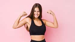 Young,Caucasian,Fitness,Woman,Doing,Sport,Isolated,Showing,Strength,Gesture