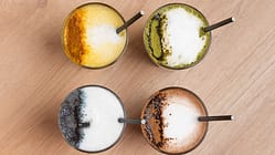 Trendy colorful latte drinks with milk foam and spices