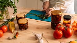 Woman chops parsley for preparing vegetables
