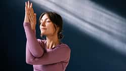Serene Woman Practicing Yoga in a Peaceful Environment Serene Woman Practicing Yoga in a Peaceful Environment
