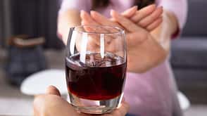 refusing,palm,focus,ice,stomach,ban,cube,female,pregnant,alcohol,glass,delicious,diarrhea,drink,stop,closeup,desk,offering,adult,care,no,woman,cold,house,two,transparent,gesture,not,cocktail,reject,beverage,diet,human,table,hand,finger,pain,poison,refusal,eating,people,food,home,lifestyle,meal,liquid,lady,avoid,fresh,sitting Close-up,Of,A,Woman's,Hand,Refusing,Glass,Of,Drink,Offered