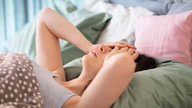 Insomnia,And,Pain.,Girl,Closed,Eyes,With,Hands,In,Bed