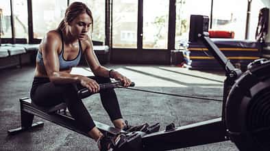 Young,Female,Athlete,Using,Rowing,Machine