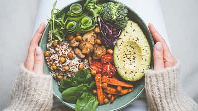 Woman,Holding,Plate,With,Vegan,Or,Vegetarian,Food.,Healthy,Plant