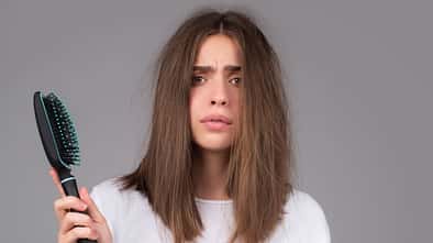Young,Woman,Is,Very,Upset,Because,Of,Hair,Loss.,Haircut