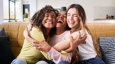 Three,Happy,Friends,Hugging,Smiling.funny,Women,Together,Celebrating,Sitting,On