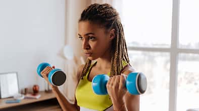 Blue,Barbells.,Close,Up,Of,Young,Dark-eyed,Sportswoman,With,Nice