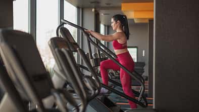 Side,View,Of,Adult,Female,In,Sportswear,Walking,Up,Stairs