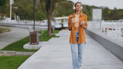 Full,Body,Young,Woman,Wear,Orange,Shirt,Casual,Clothes,Listen