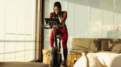 Home gym workout: Online cycling class helps black woman achieve fitness goals