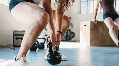 Women are training together in a gym Women are training together in a gym