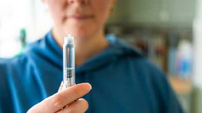 Woman preparing to administer weight loss injection Woman preparing to administer weight loss injection