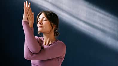 Serene Woman Practicing Yoga in a Peaceful Environment Serene Woman Practicing Yoga in a Peaceful Environment