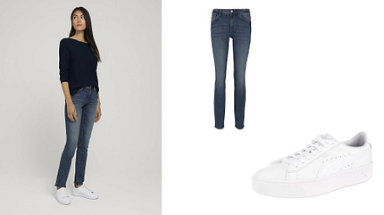 Frau trägt High-Waist-Jeans und Sneaker Frau trägt High-Waist-Jeans und Sneaker