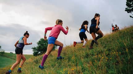 Group of female runners racing in the nature Group of female runners racing in the nature