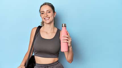 container,sportswoman,woman,exercise,cold,training,bottle,endura Sportswoman,Holding,Water,Thermos,In,Blue,Studio