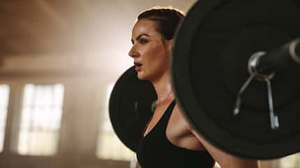 muscular,sportswoman,strong,woman,strength,squats,young,exercise Strong,Woman,Exercising,Back,Squats,With,A,Barbell.,Female,Doing