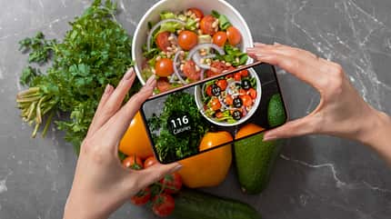 Female,Using,Dieting,App,On,A,Smartphone,To,Track,Nutrition