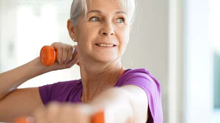 Portrait,Of,Senior,Woman,Lifting,Dumbbells