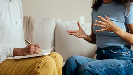 30-40 years,50-60 years,adults,caucasian,couch,female,female caucasian,freelancer,gesture,home,job,latin american ethnicity,mature adults,mature woman,mid adults,multi-ethnic group,multicultural,psychiatrist,room Patient with psychotherapist having consultation meeting at home