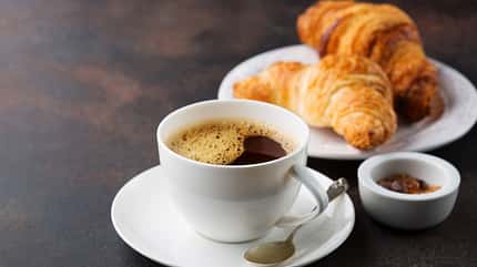 Coffee,White,Cup,,Croissants,On,Dark,Retro,Background,,Selective,Focus.