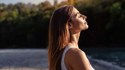 Young,Woman,With,Long,Hair,Enjoying,Sun,With,Closed,Eyes
