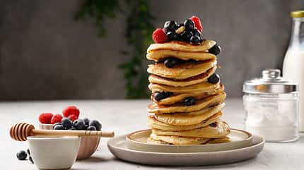 Fitness,Blueberry,Pancakes,With,Protein,,Raspberries,And,Walnuts,Stacked,On