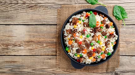 biryani,risotto,lunch,corn,pea,chinese,view,white,wood,pan,cooke Fried,Rice,With,Meat.,Prepared,And,Served,In,A,Pan.top