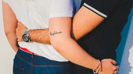 Couple,Hugging,With,Tattoo,Confidence