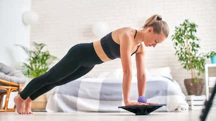 Woman,Doing,Exercise,On,A,Special,Simulator,Balancer.,Blonde,Athletic