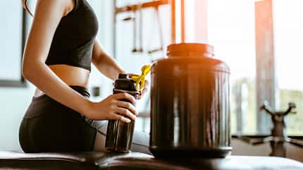 big,hands,nutrient,shake,body,bcaa,fit,white,fitness,protein,fem Relaxing,After,Training.beautiful,Young,Woman,Looking,Away,While,Sitting,At