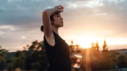 Sport lady drinking water after daily training Sport lady drinking water after daily training