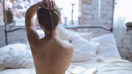 Young,Beautiful,Girl,Reading,Book,In,Romantic,Boho,Bedroom,Interior
