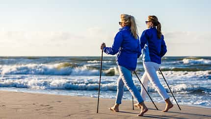Nordic,Walking,-,Two,Women,Working,Out,On,Beach