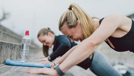 Girlfriends doing push-ups together