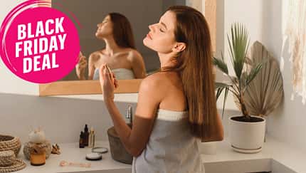 A,Beautiful,Young,Woman,Sprays,Perfume,On,Her,Neck,While