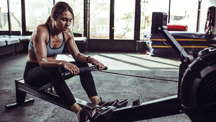 Young,Female,Athlete,Using,Rowing,Machine