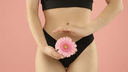 Gynecology.,Woman,In,Underwear,With,Gerbera,Flower,On,Pink,Background,