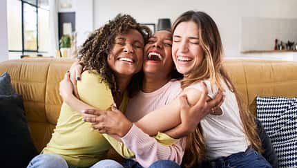 Three,Happy,Friends,Hugging,Smiling.funny,Women,Together,Celebrating,Sitting,On