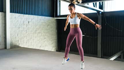 Active woman exercising in a high-intensity interval training