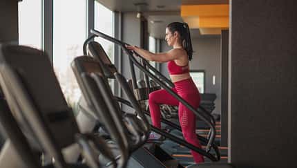 Side,View,Of,Adult,Female,In,Sportswear,Walking,Up,Stairs