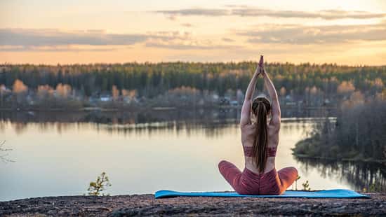 Girl,On,A,Rug,In,The,Forest,Does,Yoga