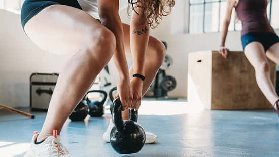 Women are training together in a gym