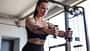 Fit,Young,Woman,Doing,Cable,Pec,Fly,Exercise,In,Gym,