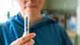 Woman preparing to administer weight loss injection