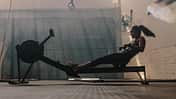muscular,young women,woman,strength,young,effort,training,exerci Woman,Doing,Cardio,Workout,On,Rowing,Machine,In,The,Gym.
