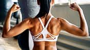 Close,Up,Of,Woman,Back,With,Flexing,Her,Muscles,In