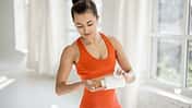 Athletic,Woman,Takes,Supplements,Or,Vitamins,In,The,Form,Of